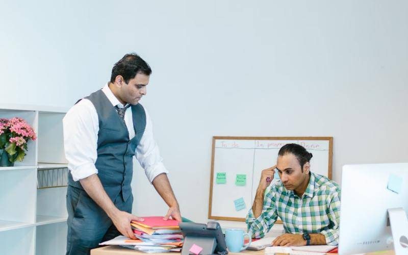 Two colleagues working together in an office