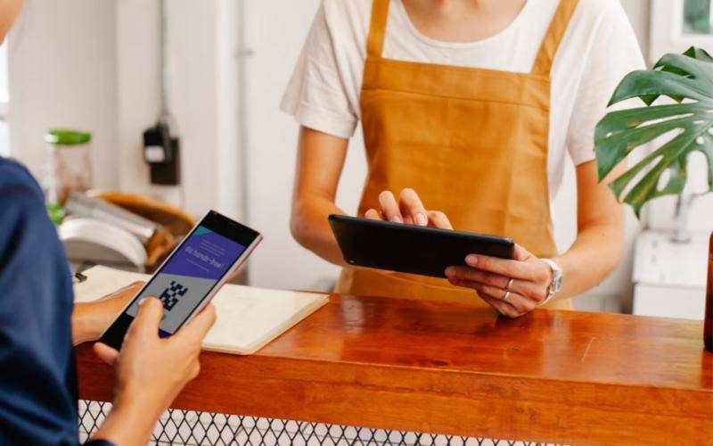 Shop counter where a customer pays by scanning a QR code